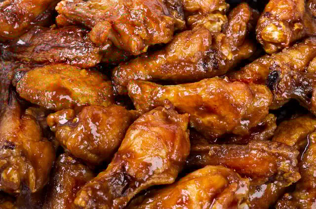 BBQ Wings slathered in sauce.