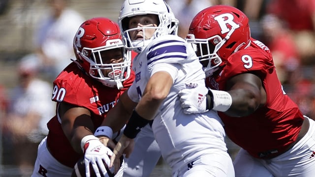 Northwestern quarterback Ben Bryant (2) is pressured by Rutgers defensive lineman Isaiah Iton (9) and has the ball knocked away by Rene Konga (90) during the first half of an NCAA college football game, Sunday, Sept. 3, 2023, in Piscataway, N.J. (AP Photo/Adam Hunger)
