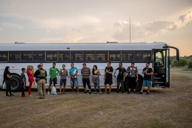 Migrants prepare to board a Border Patrol bus in Eagle Pass, Texas, on May 20, 2022. 