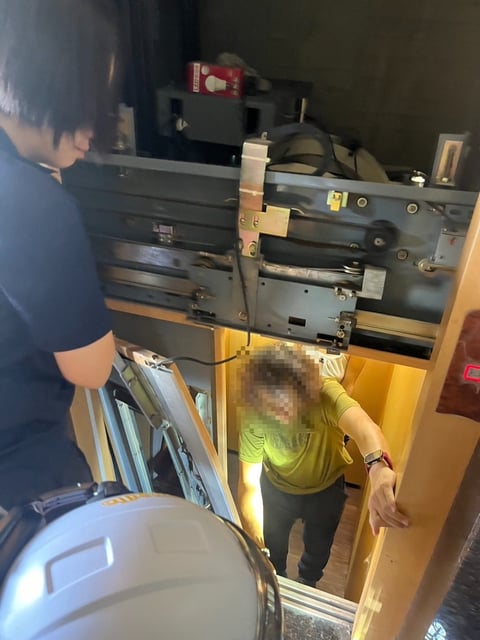 Rescuers free two people who were trapped in a lift in Hualien, Taiwan by the earthquake on Friday morning. Photo: CNA