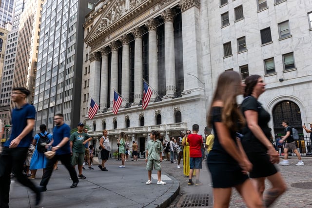 NEW YORK, NEW YORK - AUGUST 14: People walk through the financial district by the New York Stock Exchange (NYSE) on August 14, 2024, in New York City.  According to the Bureau of Labor Statistics’ latest CPI report, consumer prices rose 2.9% in July, slowing from June’s 3% annual gain.  (Photo by Spencer Platt/Getty Images)