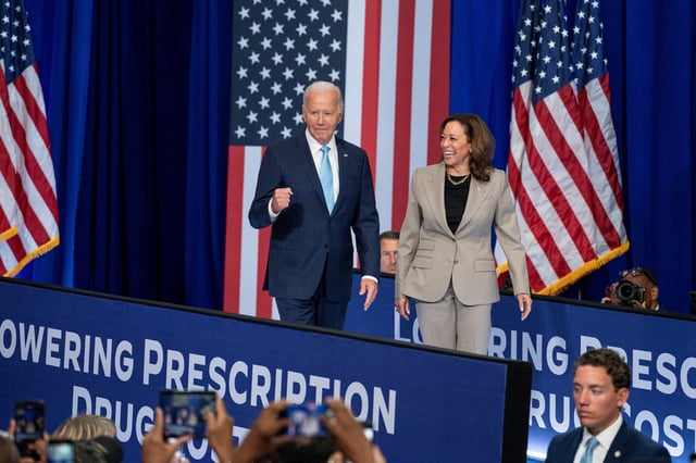 U.S. President Joe Biden enters the stage with Vice President and Democratic presidential candidate Kamala Harris, prior to delivering remarks, during an event on Medicare drug price negotiations, in Prince George's County, Maryland, U.S., August 15, 2024.