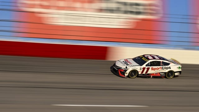 Denny Hamlin (11) competes through Turn 2 during a NASCAR Cup Series auto race at Darlington Raceway, Sunday, Sept. 3, 2023, in Darlington, S.C. (AP Photo/Matt Kelley)