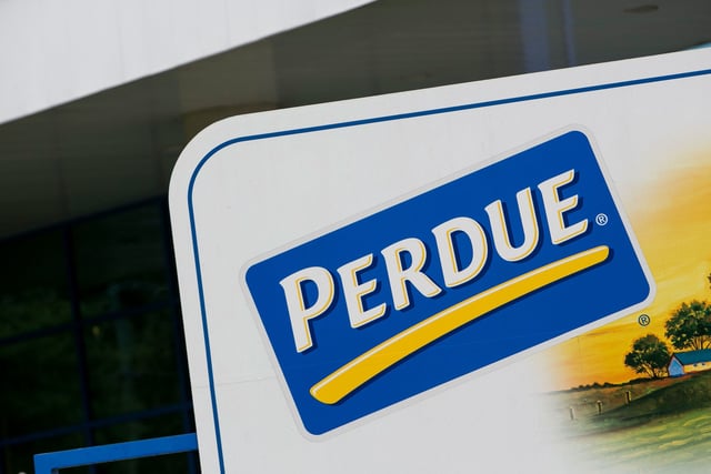 The Perdue logo is seen on a sign outside a chicken processing facility in 2015.