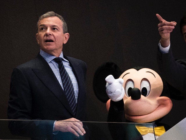 NEW YORK, NY - NOVEMBER 27: (L to R) Chief executive officer and chairman of The Walt Disney Company Bob Iger and Mickey Mouse look on before ringing the opening bell at the New York Stock Exchange (NYSE), November 27, 2017 in New York City. Disney is marking the company's 60th anniversary as a listed company on the NYSE. (Drew Angerer/Getty Images)