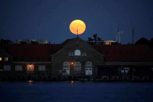 The Super Blue Moon rises over Copenhagen, Denmark on August 19, 2024. Supermoons occur when the Moon passes through its perigee, or the point that takes it closest to Earth during its elliptical orbit. This makes it look about 14 percent bigger compared to when it is at its furthest point, and a touch brighter.