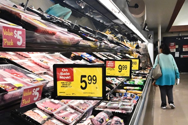 A woman browses the meat aisle at a supermarket in Montebello, Calif., on May 15, 2024.