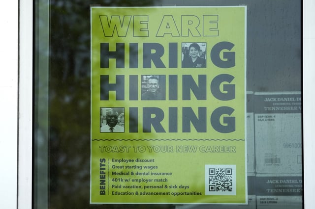 A hiring sign is displayed at a liquor store in Arlington Heights, Illinois on May 21, 2024. (Nam Y. Huh - File / AP)