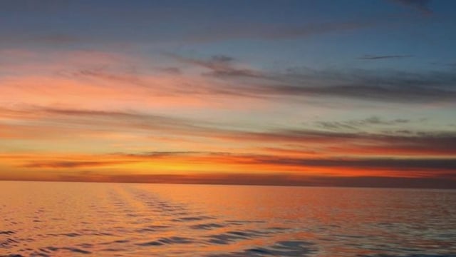 The Celebes Sea south of the Philippine Islands ripples in the evening twilight as oranges and pinks and reds stretch to every horizon in this 360-degree view. 2023 saw record surface sea temperatures, and  a new paper provides insight on the phenomenon, super-marine heatwaves. Image via NOAA Okeanos Explorer Program, INDEX-SATAL 2010.