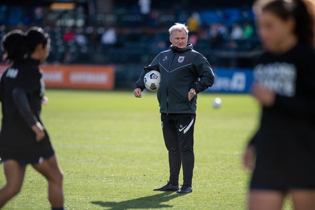 TACOMA, WA - OCTOBER 10: OL Reign assistant coach Sam Laity before a game between Chicago Red Stars and OL Reign at Cheney Stadium on October 10, 2021 in Tacoma, Washington.