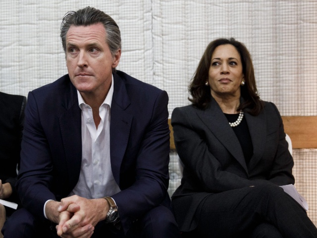 Gavin Newsom, Democratic candidate for governor of California, center, sits next to his wife Jennifer Newsom, left, and Senator Kamala Harris, a Democrat from California, right, during a rally in Burbank, California, U.S., on Wednesday, May 30, 2018. The Democratic candidates running to replace Governor Jerry Brown -- Lieutenant Governor Newsom, former Los Mayor Antonio Villaraigosa and State Treasurer John Chiang-- have pledged to protect the rights of undocumented immigrants. Photographer: Patrick T. Fallon/Bloomberg via Getty Images