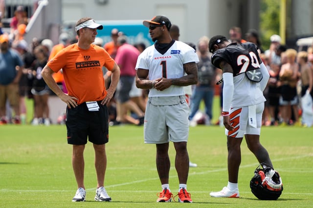 Bengals Ja'Marr Chase hangs out with coaches and players during their training camp on Tuesday July 30, 2024.