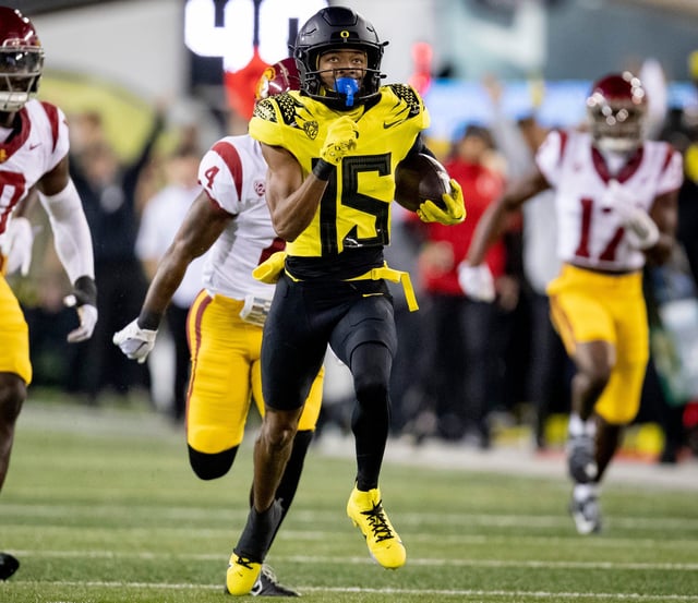 Oregon wide receiver Tez Johnson breaks free for a touchdown during his team's game against Southern Calfiornia, Saturday, Nov. 11, 2023, at Autzen Stadium in Eugene, Ore.