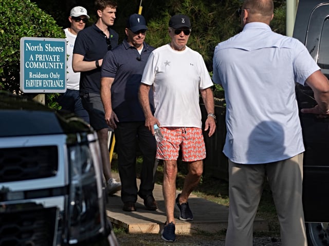 Secret Service agents provide security as US President Joe Biden walks to his vehicle after spending some time at the beach in Cape Henlopen State Park, in Lewes, Delaware, on August 28, 2024. (Photo by ROBERTO SCHMIDT / AFP)