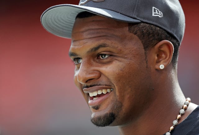 Cleveland Browns quarterback Deshaun Watson smiles as he takes the field before an NFL preseason football game against the Minnesota Vikings at Cleveland Browns Stadium, Saturday, Aug. 17, 2024, in Cleveland, Ohio.