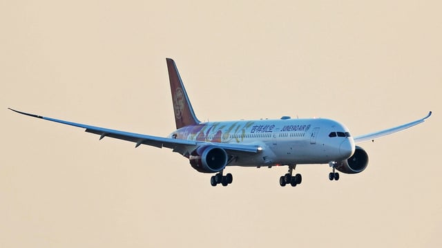 A Juneyao Airlines Boeing 787 Dreamliner plane prepares to land at Shanghai Pudong International Airport on December 22, 2023.