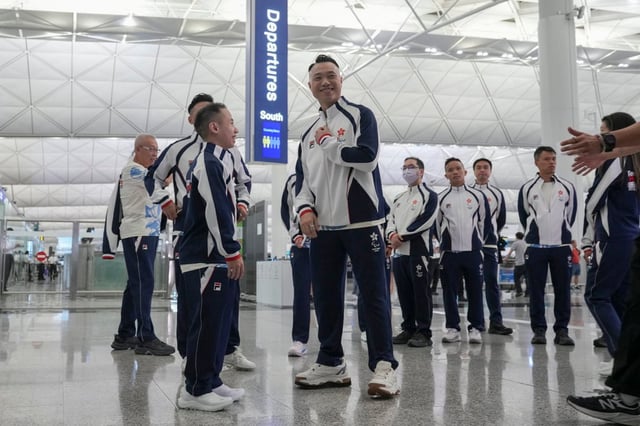 Badminton players Chu Man-kai (left) and Daniel Chan Ho-yuen, and fellow members of the Hong Kong China delegation, depart for the Paris 2024 Paralympic Games. Photo: Eugene Lee