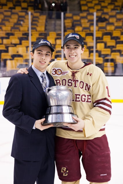 Brothers Johnny Gaudreau #13 and Matthew Gaudreau #21 of the Boston College Eagles celebrate after the Eagles beat the Northeastern University Huskies to win their fifth Beanpot Championship in a row in NCAA hockey action in the championship game of the annual Beanpot Hockey Tournament at TD Garden on February 10, 2014.
