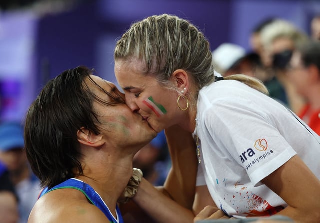 Paris 2024 Paralympics - Athletics -  Men's 100m - T63 Round 1 - Stade de France, Saint-Denis, France - September 1, 2024
Alessandro Ossola of Italy after proposing to his girlfriend after the race REUTERS/Eng Chin An
