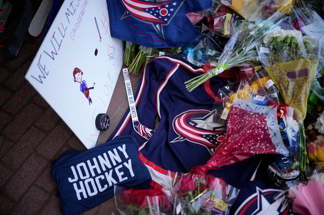 A makeshift memorial grows outside Nationwide Arena for Columbus Blue Jackets forward Johnny Gaudreau. Gaudreau and his brother, Matthew, who were killed in a bicycle accident the night before.