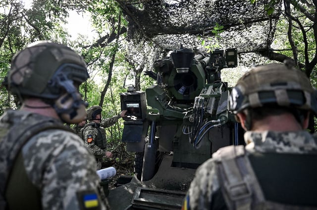 Ukrainian soldiers are seen on a combat mission in the Pokrovsk direction, Donetsk region, eastern Ukraine, on August 13, 2024.