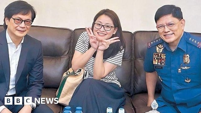 Alice Guo is seen flashing a wide smile and the peace sign with the smiling interior minister and chief of the Philippine National Police