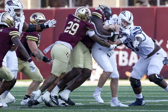 The Texas State defense locks up UTSA quarterback Eddie Lee Marburger during the second half of Saturday’s game in San Marcos. Texas State beat UTSA 49-10. An impasse between DirecTV and Disney over a new carriage agreement meant the game was blacked out for DirecTV customers.