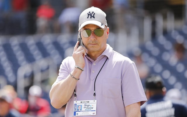 WEST PALM BEACH, FLORIDA - MARCH 12: New York Yankees general manager Brian Cashman talks on the phone prior to a Grapefruit League spring training game between the Washington Nationals and the New York Yankees at FITTEAM Ballpark of The Palm Beaches on March 12, 2020 in West Palm Beach, Florida. Many professional and college sports are canceling or postponing their games due to the ongoing threat of the Coronavirus (COVID-19) outbreak. (Photo by Michael Reaves/Getty Images)