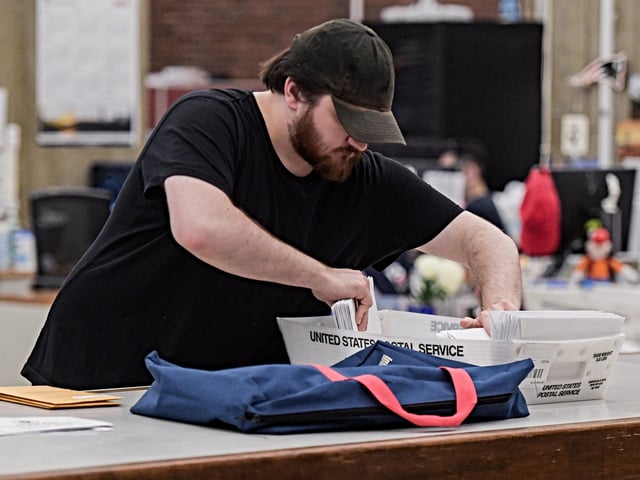A staff member collects mail-in ballots during the primary race of the 2024 U.S. presidential election in Boston, Massachusetts, the United States, on March 5, 2024. U.S. President Joe Biden and former President Donald Trump swept to victory in their respective party's presidential primaries on "Super Tuesday" when over a dozen states held primary elections, increasing the likelihood of a rematch between the two. "Super Tuesday" is the biggest day for the primary race of the 2024 U.S. presidential election, when approximately one-third of all delegates to the Republican or Democratic conventions are to be distributed. (Photo by Ziyu Julian Zhu/Xinhua via Getty Images)