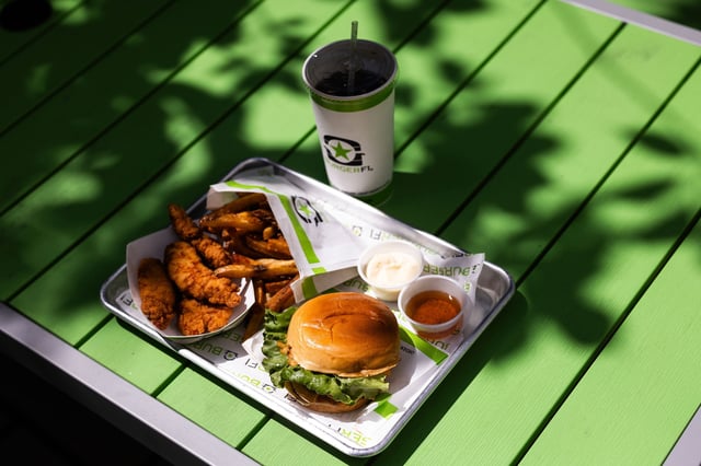 In this photo illustration, a burger, fries, and chicken tenders from BurgerFi are displayed on August 20, 2024 in Arlington, Virginia.