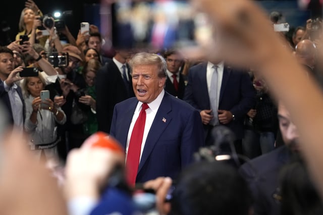 Republican presidential nominee former President Donald Trump speaks to reporters in the spin room after a presidential debate with Democratic presidential nominee Vice President Kamala Harris, Tuesday, Sept. 10, 2024, in Philadelphia. (AP Photo/Matt Slocum)