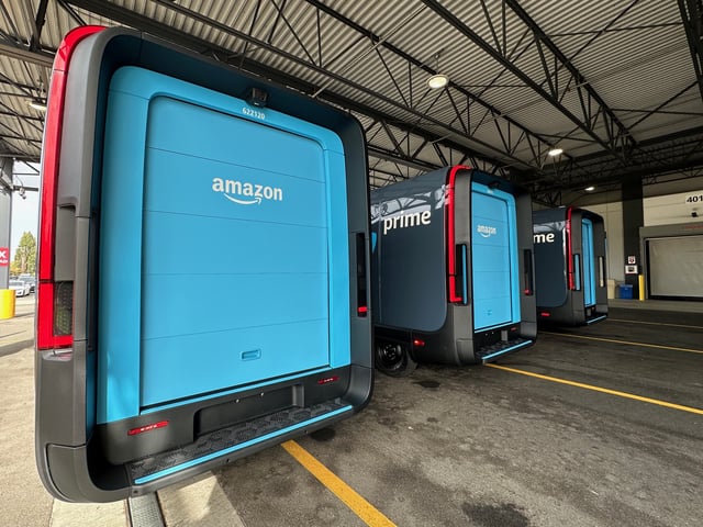 The distinctive rear blue cargo door and wrapping tail light on the Amazon delivery vans. (GeekWire Photo / Kurt Schlosser)