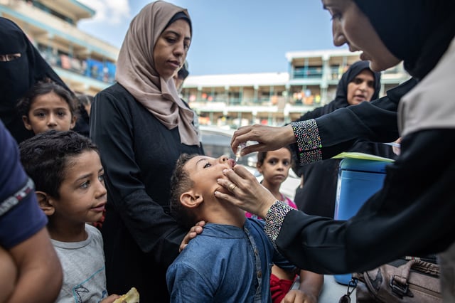 A child receives a vaccination for polio at a make-shift camp run by the UNRWA in Khan Younis in the southern Gaza Strip on Sept. 5, 2024.