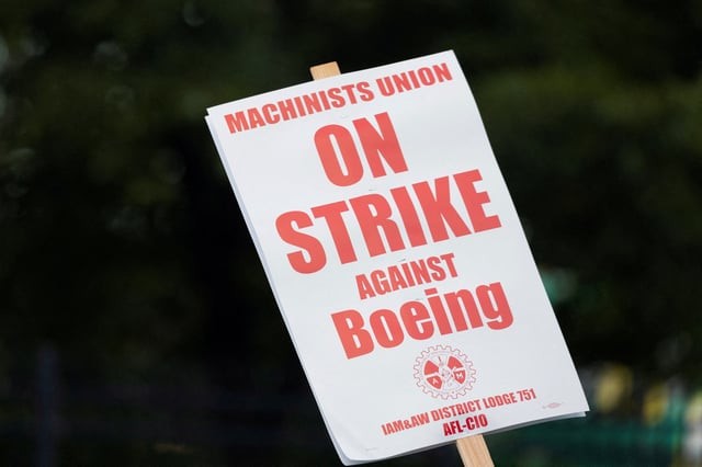 Signage seen on a picket line during the first day of a strike near the entrance of a production facility in Renton, Washington, U.S., September 13, 2024. REUTERS/Matt Mills McKnight/File Photo