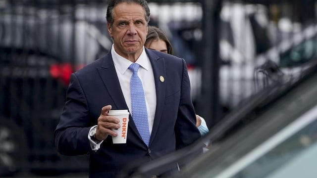 FILE - New York Gov. Andrew Cuomo prepares to board a helicopter after announcing his resignation, Aug. 10, 2021, in New York. A commission created by New York's governor and Legislature in 2022 as an independent ethics authority violates the state constitution because it is beyond the governor's control, a state judge said Monday, Sept. 11, 2023, in a ruling in favor of Cuomo, the state's former governor. (AP Photo/Seth Wenig, File)