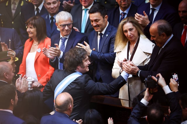 Argentine President Javier Milei greets Cabinet Chief Guillermo Francos as General Secretary of the Presidency Karina Milei looks on, on the day President Javier Milei presents the fiscal year 2025 budget, at the National Congress in Buenos Aires, Argentina, September 15, 2024. REUTERS/Agustin Marcarian