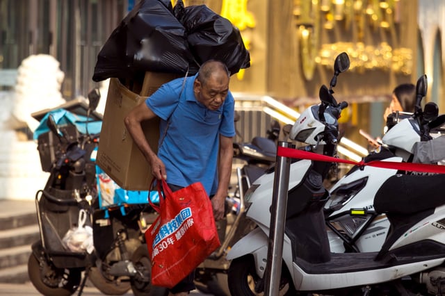 Chinese Man Carries Collects Recyclables in Chongqing