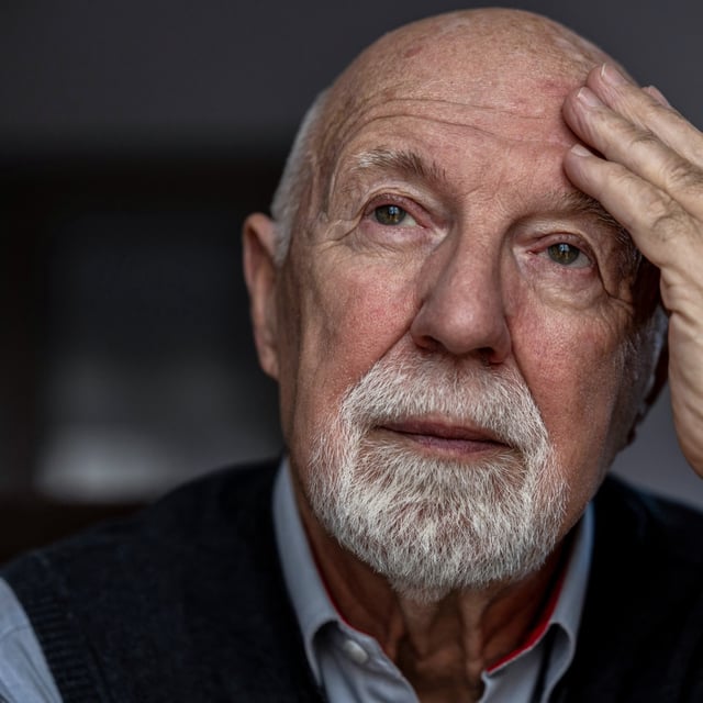 A portrait of a senior man touching his forehead. Type 2 diabetes is linked with a higher risk of neurodegenerative diseases, such as vascular dementia, Alzheimer's and Parkinson's disease.