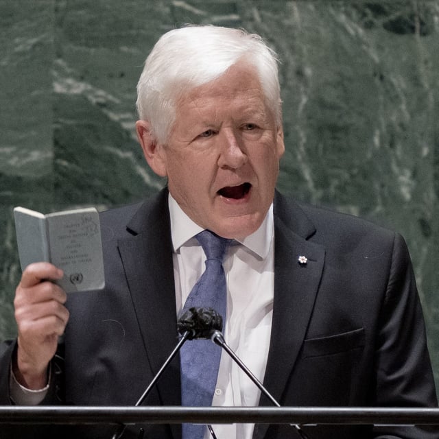 Bob Rae, ambassador of Canada to the United Nations, speaks while holding a copy of the United Nations charter at the general assembly hall, Wednesday, Feb. 23, 2022, at United Nations Headquarters. Canada abstained today in a high-profile United Nations vote demanding that Israel end its "unlawful presence" in Gaza and the occupied West Bank within a year. THE CANADIAN PRESS/AP/John Minchillo