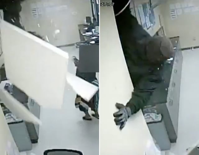 Screengrabs of video provided by the Atlanta Police Department showing a masked robber crashing through the ceiling of a cheque-cashing store.
