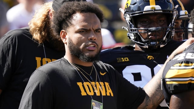 Iowa defensive lineman Noah Shannon watches teammates warmup before an NCAA college football game against Utah State, Saturday, Sept. 2, 2023, in Iowa City, Iowa. (AP Photo/Charlie Neibergall)