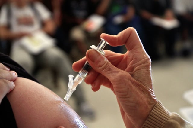 A student from Huntington Park high school gets a whooping cough shot, in Huntington Park, Calif., on July 6, 2011. 