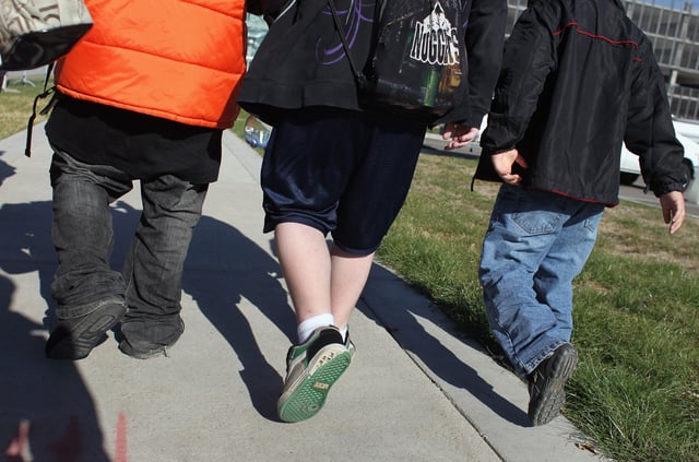 Children walk to an exercise class