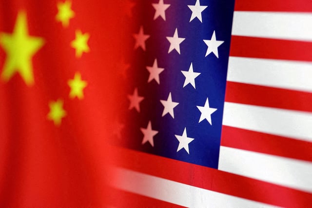 U.S. and Chinese flags are seen in this illustration, taken January 30, 2023. REUTERS/Dado Ruvic/Illustration/File Photo