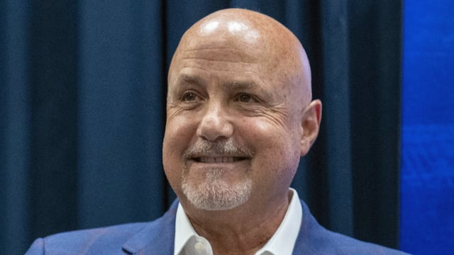 FILE - Washington Nationals general manager Mike Rizzo smiles during a media availability at Nationals Park, Saturday, July 22, 2023, in Washington. The Nationals are giving longtime president of baseball operations and general manager Mike Rizzo a chance to finish what he started. The club signed Rizzo to a multi-year extension on Wednesday, Sept. 13. (AP Photo/Alex Brandon, File)