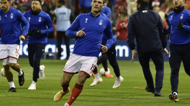 FILE - Nottingham Forest's Harry Toffolo, centre, warms up before the English Premier League soccer match between Nottingham Forest and Aston Villa at the City ground in Nottingham, England, Monday, Oct.10, 2022. Nottingham Forest defender Harry Toffolo was given a suspended five-month ban for breaching English soccer's betting rules, the Football Association said Wednesday, Sept. 13, 2023. (AP Photo/Rui Vieira, File)