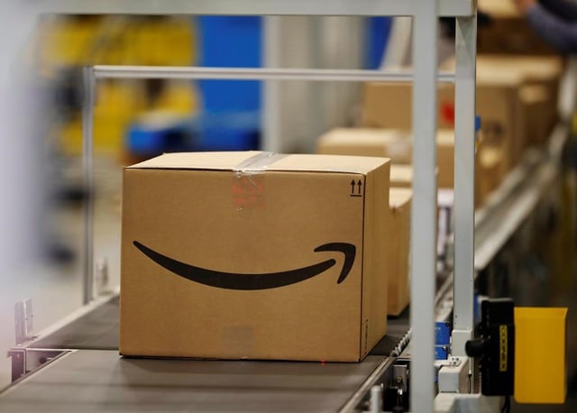 Boxes on a conveyor belt during a tour of the Amazon fulfillment centre in Aurora, Colo., on May 3, 2018. 