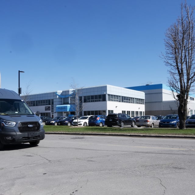 Amazon.com Inc. says some customers in Canada can now start getting their packages delivered to their garage. The Amazon DXT4 warehouse is seen in Laval, Que., Monday, April 22, 2024. THE CANADIAN PRESS/Ryan Remiorz